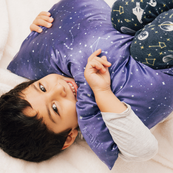 toddler with a silk baby pillowcase