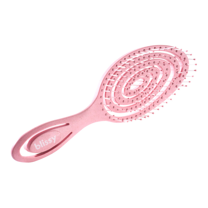 Pink paddle hairbrush with 'blissy' branding on a white background